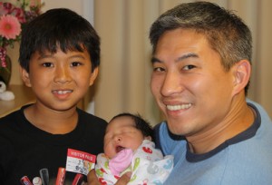 Jim Lin with his son and new daughter