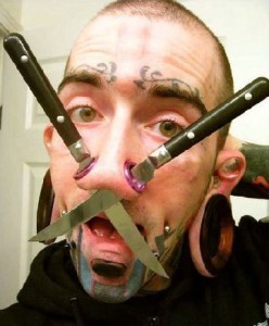 guy with knives thru his nose
